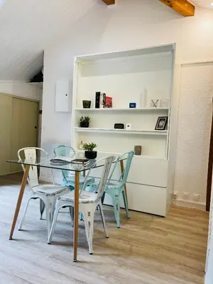 a dining room with a glass table and chairs at Al_titude1138 in Les Contamines-Montjoie