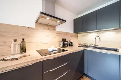 a kitchen with a sink and a counter top at Apartment Opale Megève - by EMERALD STAY in Megève