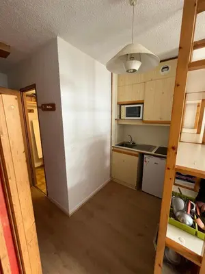 a small kitchen with a sink and a microwave at Aiguille du midi in Chamonix-Mont-Blanc