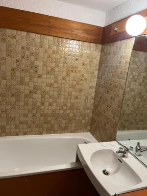 a bathroom with a tub and a sink and a bath tub at Aiguille du midi in Chamonix-Mont-Blanc