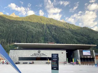 a building with a mountain in the background at Aiguille du midi in Chamonix-Mont-Blanc
