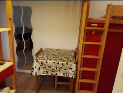 a room with a stool and a bunk bed at Aiguille du midi in Chamonix-Mont-Blanc