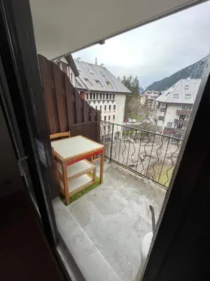 a view from a window of a table on a balcony at Aiguille du midi in Chamonix-Mont-Blanc