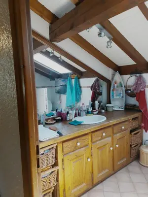 a bathroom with a sink and a counter at Chambre privee in Sallanches