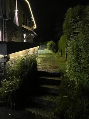a set of stairs leading to a building at night at Chalet 8 Etoiles in Chamonix-Mont-Blanc