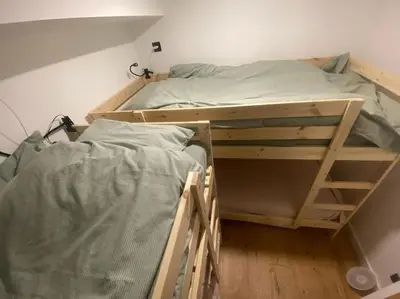 a bedroom with two bunk beds in a room at Appartement T2 de Standing Neuf 6-8 personnes avec Balcon et Jardinet au Pied des Pistes à Combloux in Combloux