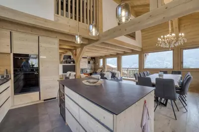 a kitchen and dining room with a table and chairs at Chalet familial vue MontBlanc in Saint-Gervais-les-Bains