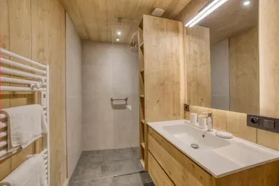 a bathroom with a sink and a mirror at Chalet familial vue MontBlanc in Saint-Gervais-les-Bains