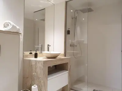 a bathroom with a sink and a glass shower at Saskya 5 65m2, 2 bedrooms, next to the ski lift in Samoëns