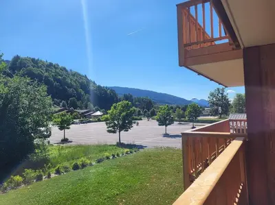 a balcony of a building with a parking lot at Saskya 5 65m2, 2 bedrooms, next to the ski lift in Samoëns