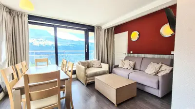 a living room with a couch and a table at Résidence Les Terrasses De Veret - Appartement lumineux · Au pied des pistes · Piscine · Parking inclus · Spa MAE-1651 in Magland