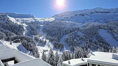a view of a snow covered mountain with trees at Résidence Les Terrasses De Veret - Appartement lumineux · Au pied des pistes · Piscine · Parking inclus · Spa MAE-1651 in Magland