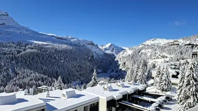 a view of a resort with snow covered trees and mountains at Résidence Les Terrasses De Veret - Appartement lumineux · Au pied des pistes · Piscine · Parking inclus · Spa MAE-1651 in Magland