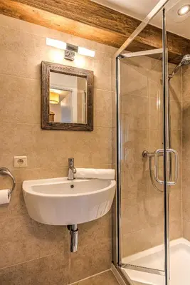 a bathroom with a sink and a shower at La Tramousse - - Alpes Travel - Chamonix Centre - Sleeps 6 in Chamonix-Mont-Blanc