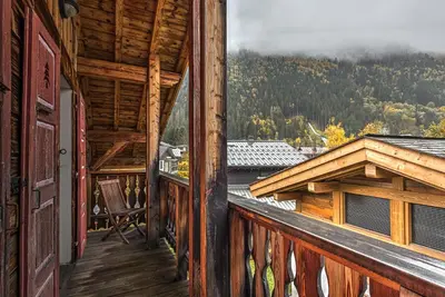 a balcony of a cabin with a view of the mountains at La Tramousse - - Alpes Travel - Chamonix Centre - Sleeps 6 in Chamonix-Mont-Blanc