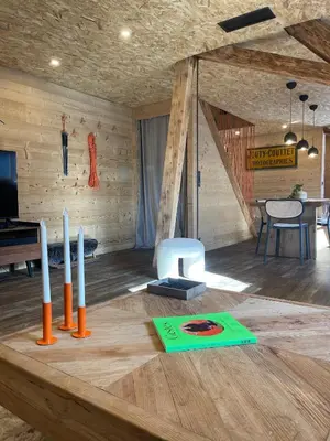 a room with a wooden table with candles on it at Chalet Atmosphere Chamonix City Center Large T3 in Chamonix-Mont-Blanc