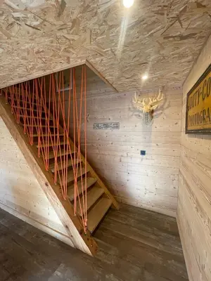 a staircase in a room with wooden walls at Chalet Atmosphere Chamonix City Center Large T3 in Chamonix-Mont-Blanc