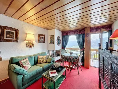 a living room with a couch and a table at Appartement 2 pièces avec parking, au pied des pistes - FR-1-560-134 in Combloux