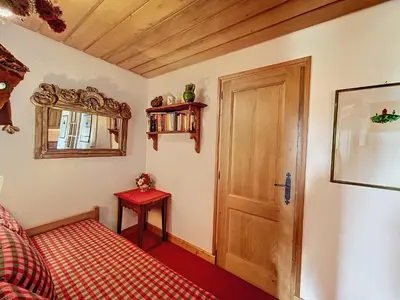a room with a door and a table and a mirror at Appartement 2 pièces avec parking, au pied des pistes - FR-1-560-134 in Combloux