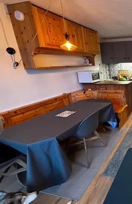 a kitchen with a table with a blue cloth on it at Studio Bettex 4p- vue Mont-Blanc in Saint-Gervais-les-Bains
