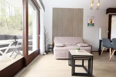 a living room with a couch and a table at Résidence Les Esserts - Les Esserts MAE-8381 in Les Houches