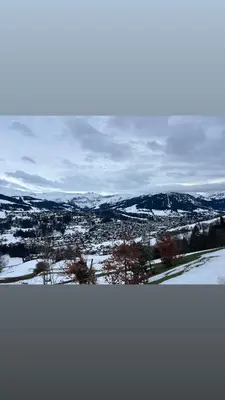 a view of a snowy field with mountains in the distance at I love Megève in Megève