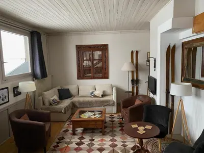 a living room with a couch and chairs and a table at Villa Jules in Chamonix-Mont-Blanc