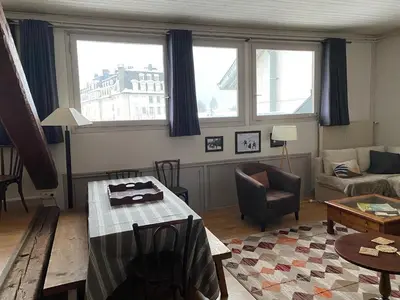 a living room with a table and a couch at Villa Jules in Chamonix-Mont-Blanc