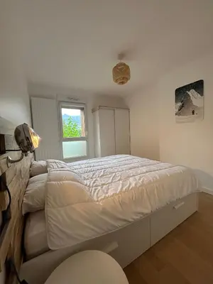 a bedroom with a large bed in a room at Appartement Samoens l'Etelley in Samoëns