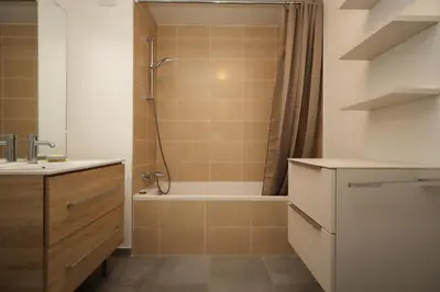 a bathroom with a shower and a tub and a sink at Résidence Hameau Des Reines - Hameau des Reines MAE-9981 in Servoz