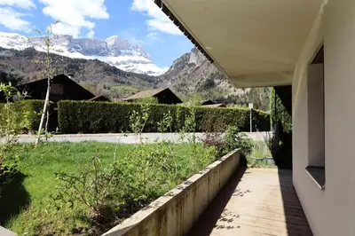 a view of a mountain from the porch of a house at Résidence Hameau Des Reines - Hameau des Reines MAE-9981 in Servoz