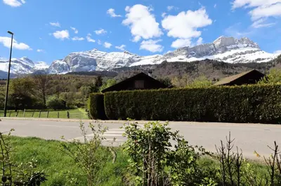 a view of a mountain range with snow covered mountains at Résidence Hameau Des Reines - Hameau des Reines MAE-9981 in Servoz