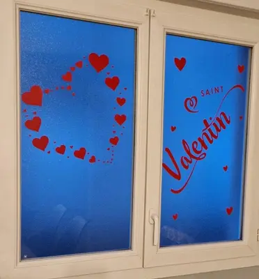 a window with hearts painted on it with the words quarantine at Appartement l'Étoile pour 1 à 4 personnes in Sallanches