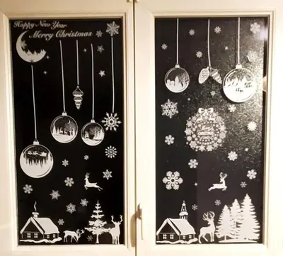 a window with christmas decorations and lights hanging from it at Appartement l'Étoile pour 1 à 4 personnes in Sallanches