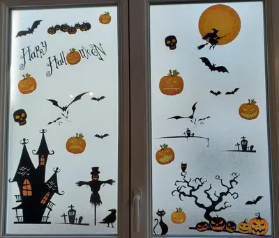 a window with halloween decorations on it at Appartement l'Étoile pour 1 à 4 personnes in Sallanches