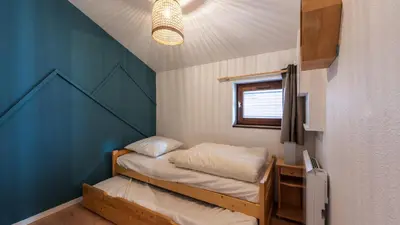 a small room with two bunk beds in it at LES ARCADES - 310 - Appt accueillant 4-6 pers in Morillon
