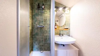 a bathroom with a sink and a shower at LES ARCADES - 310 - Appt accueillant 4-6 pers in Morillon