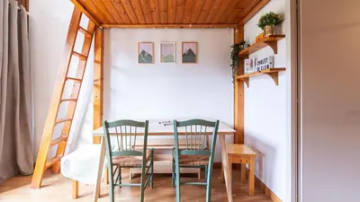 a small dining room with a table and chairs at LES ARCADES - 310 - Appt accueillant 4-6 pers in Morillon