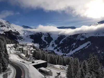 a view of a ski resort in the snow at Résidence Les Terrasses D'eos - Appartement spacieux · Accès direct aux pistes · Piscine · WIFI gratuit et illimité · Spa MAE-1661 in Magland