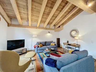 a living room with two blue couches and a tv at Appartement de Standing 4 Chambres au Pied des Pistes à Combloux - FR-1-560-122 in Combloux