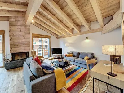 a living room with a couch and a table at Appartement de Standing 4 Chambres au Pied des Pistes à Combloux - FR-1-560-122 in Combloux