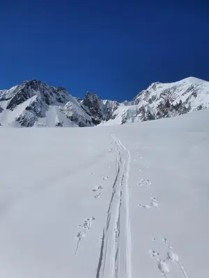 a ski trail in the snow in front of a mountain at The Mountain View in Les Houches
