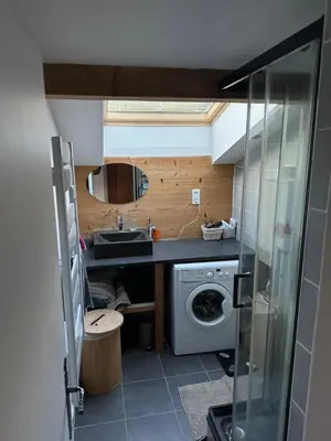 a small kitchen with a sink and a washing machine at The Mountain View in Les Houches