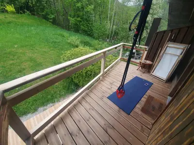 a wooden deck with a mop on it at The Mountain View in Les Houches