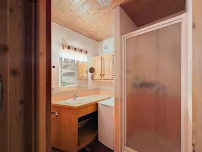 a bathroom with a sink and a shower at Le cosy refuge in Chamonix-Mont-Blanc
