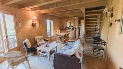 a living room with a couch and a table at Bienvenue dans notre chalet à Saint-Gervais-les-Bains in Saint-Gervais-les-Bains