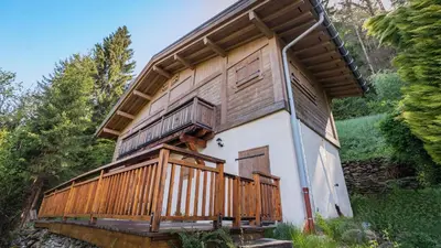 a house with a balcony on the side of it at Bienvenue dans notre chalet à Saint-Gervais-les-Bains in Saint-Gervais-les-Bains