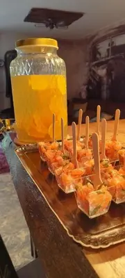 a tray of food on a table with a jar of honey at Bivouac & Sacs à dos - Loft classé, avec escape game sur demande in Sixt