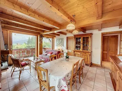 a kitchen and dining room with a table and chairs at Appartement 3P avec parking proche des pistes à Combloux - FR-1-560-135 in Combloux
