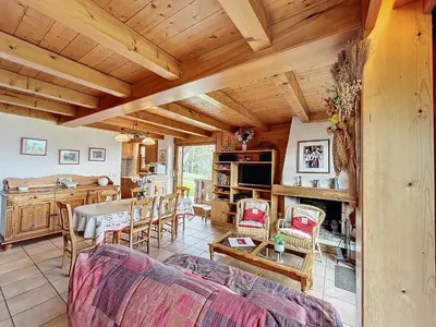 a living room with a couch and a table at Appartement 3P avec parking proche des pistes à Combloux - FR-1-560-135 in Combloux